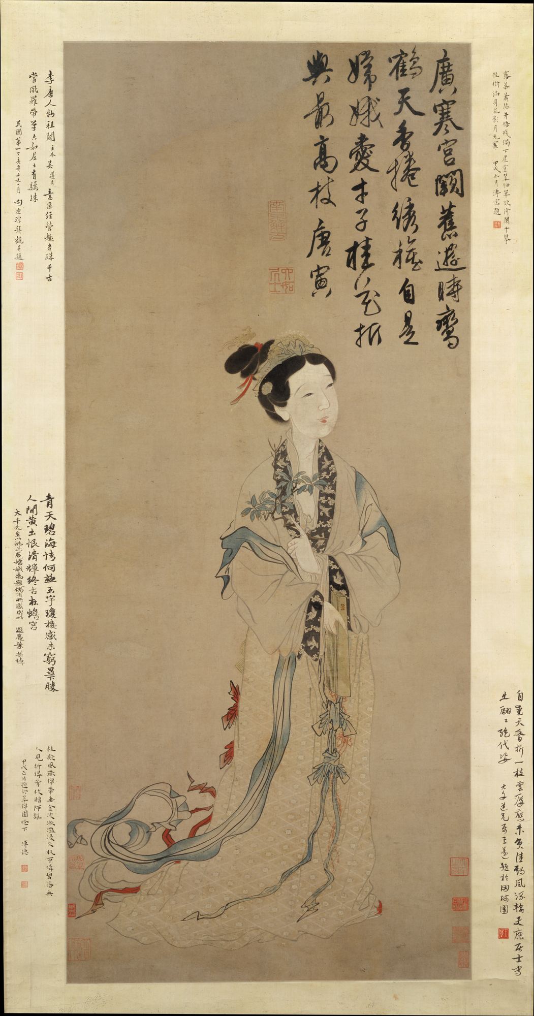 The moon goddess Chang'e in flowing robes holding a branch of cassia, a Ming dynasty hanging scroll