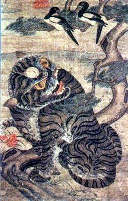 A tiger crouched among rocks with magpies in a branch above, a Korean minhwa folk painting